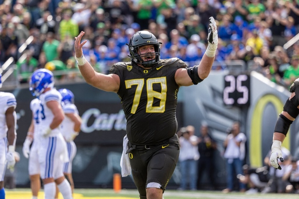 Offensive lineman Alex Forsyth of the Oregon Ducks celebrates against the Brigham Young Cougars during the second half at Autzen Stadium.