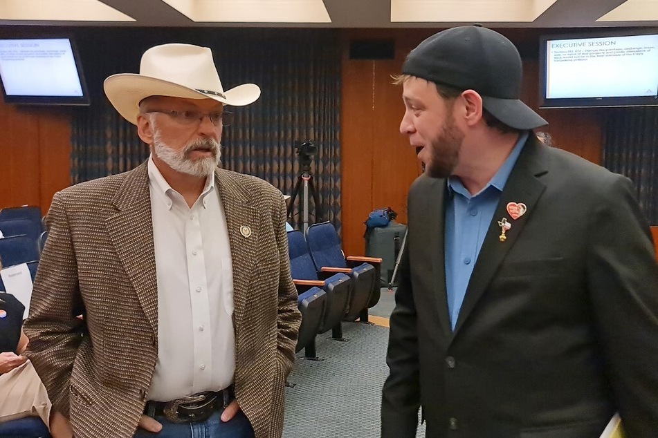 John Barrett (l.), a conservative Amarillo resident, and Mark Lee Dickson, founder of the Sanctuary Cities for the Unborn initiative, talk during a city council session where they requested authorities to allow civil suits against those who transport or help someone looking for an abortion using the city roads.