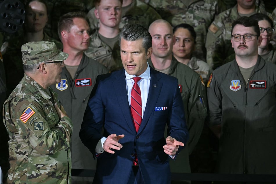 US Secretary of Defence, Pete Hegseth (c.), speaks with members of the military before US President Donald Trump delivers remarks to the Michigan National Guard at Selfridge Air National Guard Base in Warren, Michigan, on April 29, 2025.