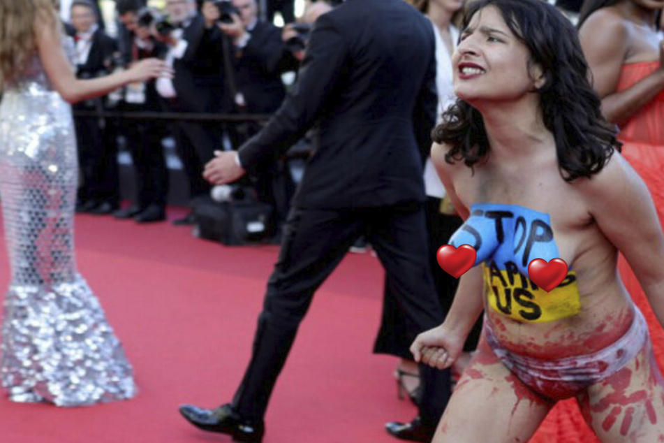 Nackter Protest: Aktivistin stürmt roten Teppich von Cannes