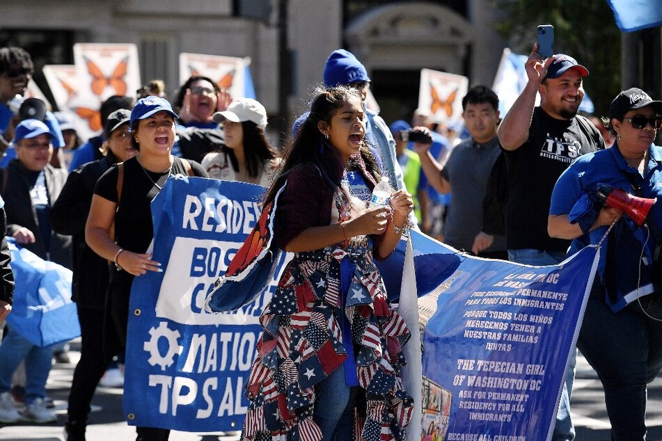 TPS families and allies rally near the White House in Washington DC in September 2022.