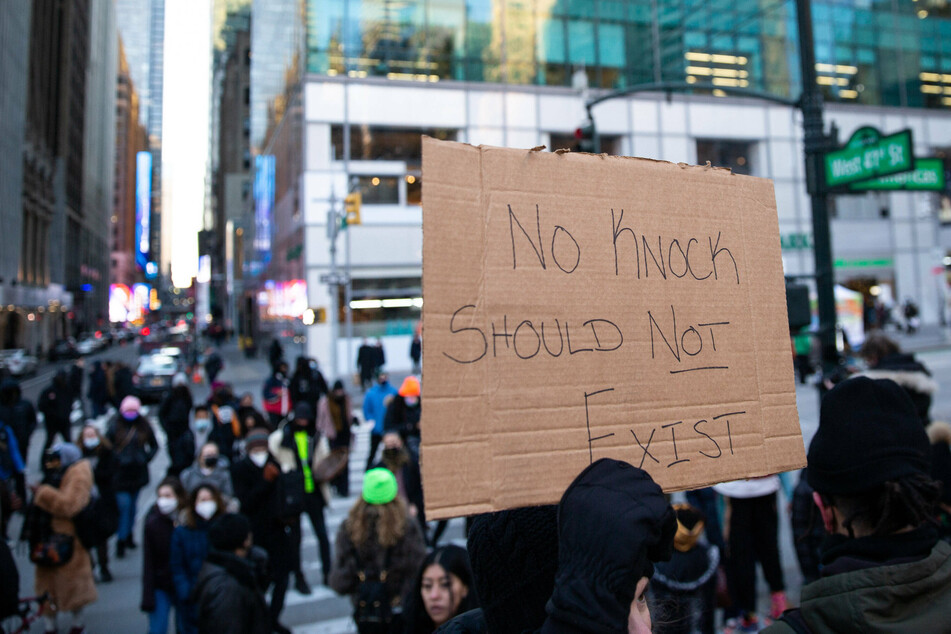 Black Lives Matter protesters rallied in Times Square in New York City following the police killing of Amir Locke.