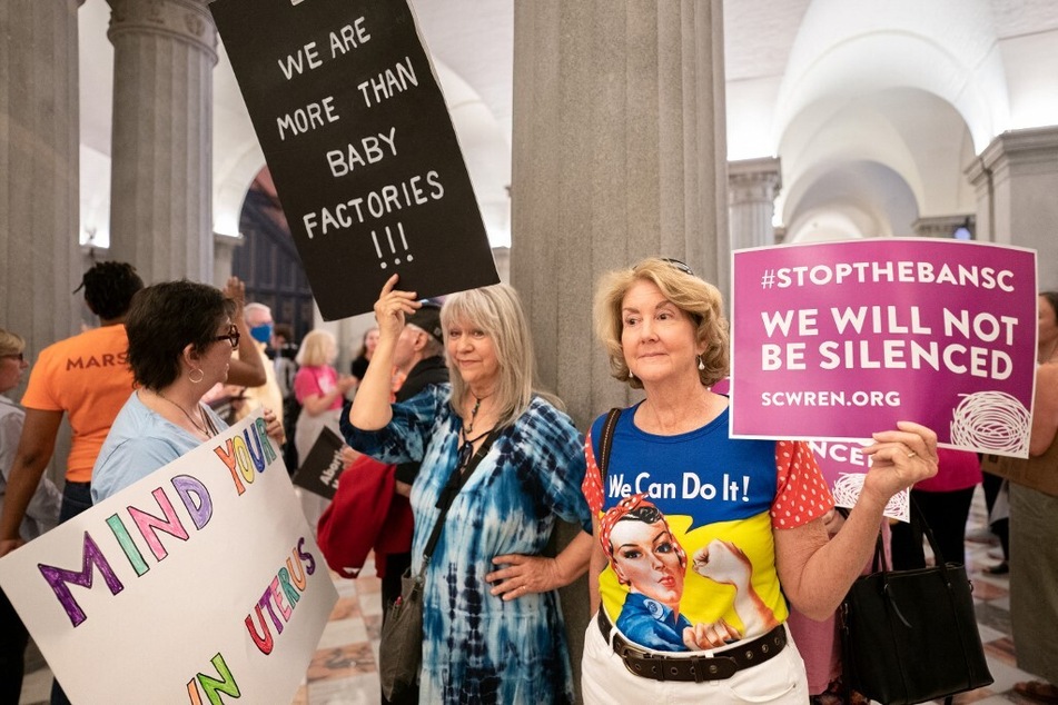 Abortion rights activists wait for state lawmakers to arrive before a Senate vote on a ban on abortion after six weeks of pregnancy at the South Carolina Statehouse on May 23, 2023.