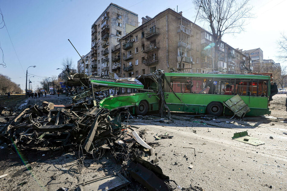 Anti-aircraft forces shot down a piece of falling missile over Kyiv, but its fragments struck an apartment building and a bus, killing at least two people.