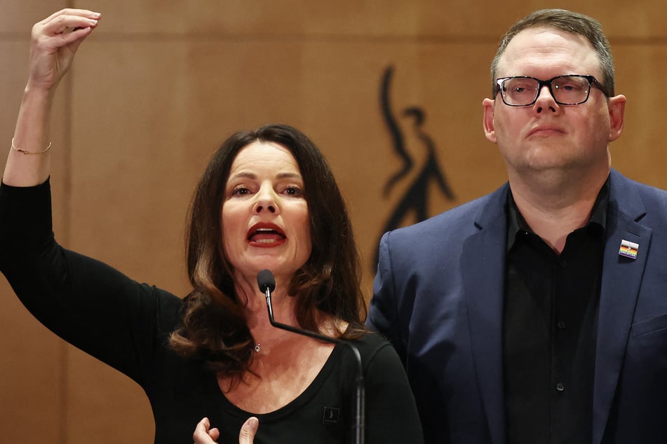 SAG-AFTRA President Fran Drescher (L) speaks as SAG-AFTRA National Executive Director Duncan Crabtree-Ireland (R) looks on at a press conference discussing their strike-ending deal with the Hollywood studios on Friday in Los Angeles.