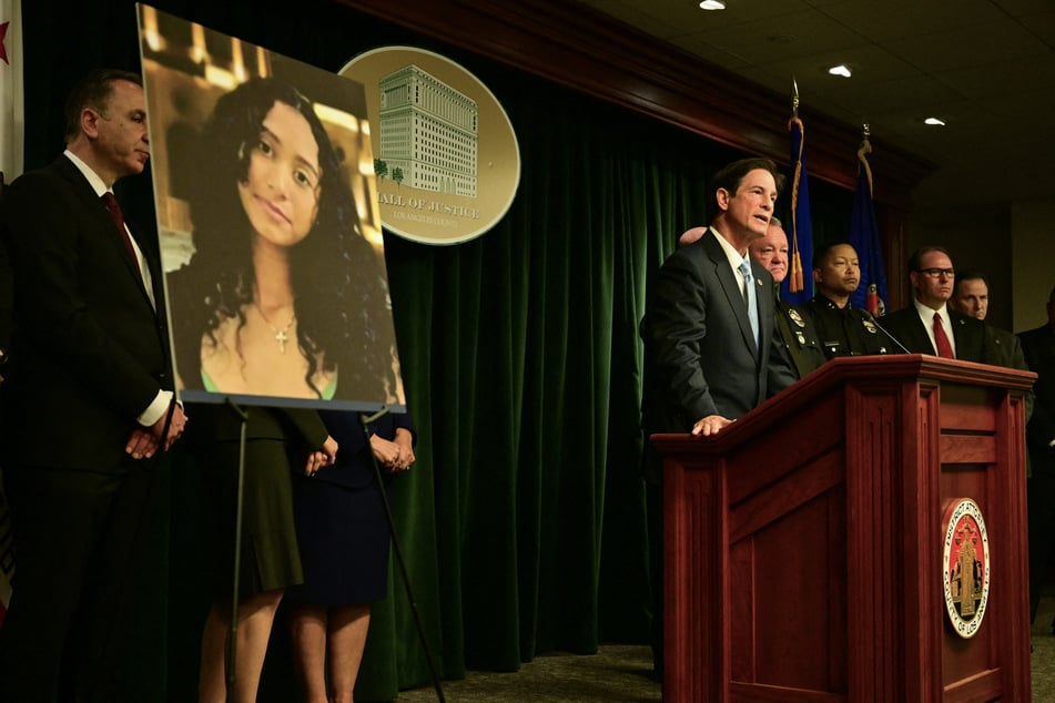 A photo of Celeste Rivas Hernandez is displayed as Los Angeles County District Attorney Nathan J. Hochman and LAPD Chief Jim McDonnell hold a press briefing on the case against singer D4vd on April 20, 2026.