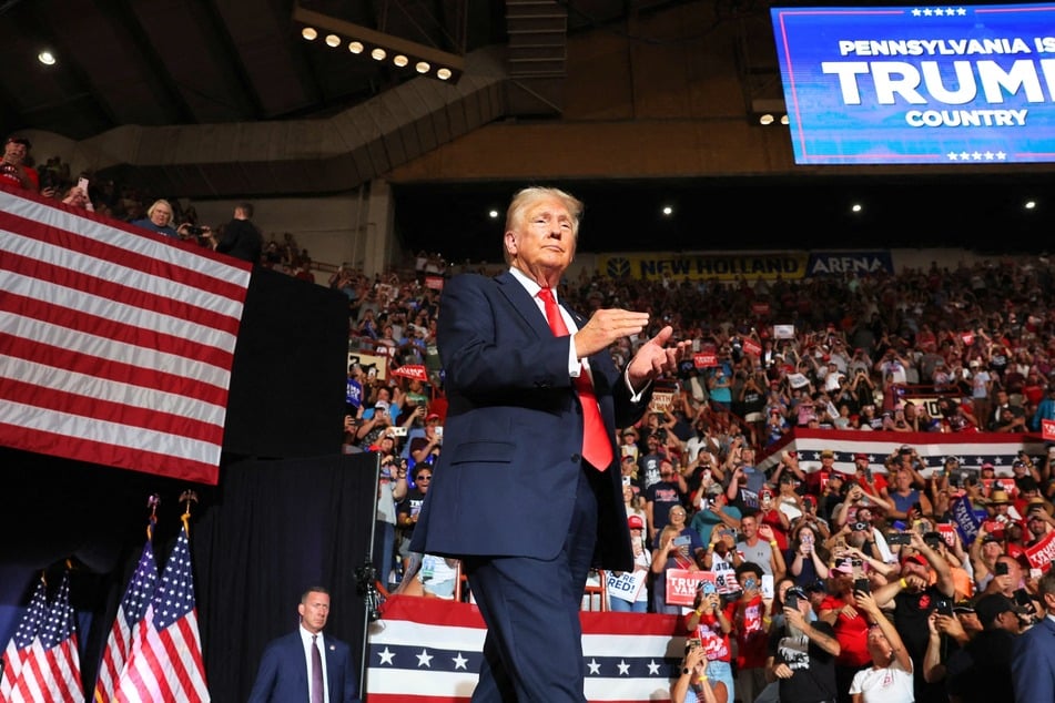 Republican presidential candidate Donald Trump walking onto the stage at his campaign rally in Harrisburg, Pennsylvania on July 31, 2024.