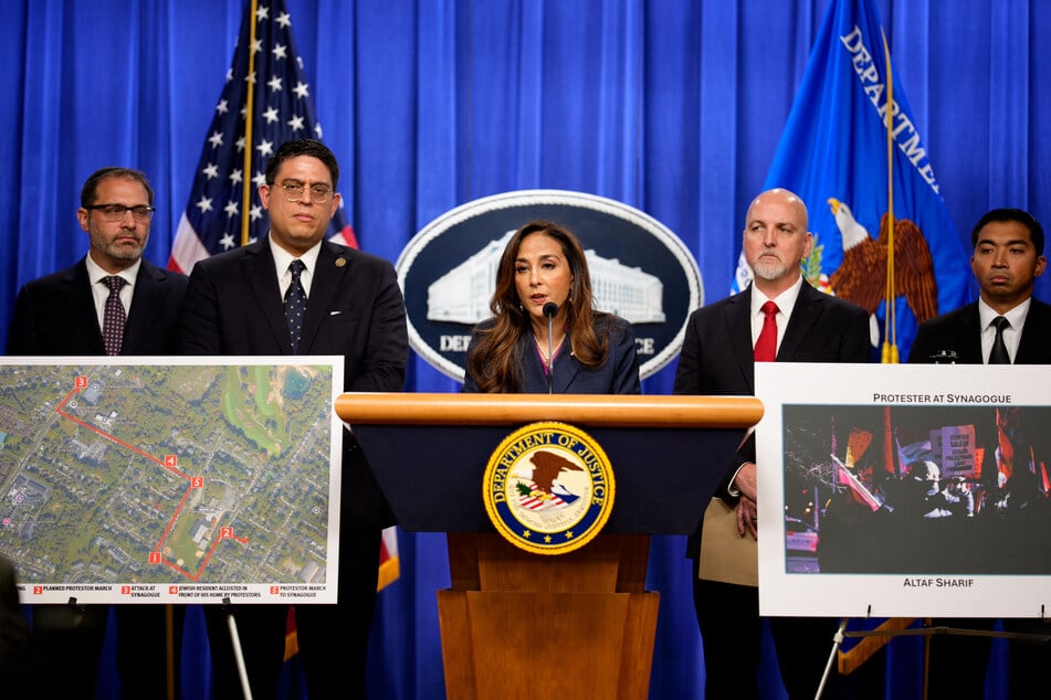 Assistant Attorney General for Civil Rights Harmeet Dhillon (c.), accompanied by her aides, speaks during a news conference at the Justice Department on September 29, 2025.