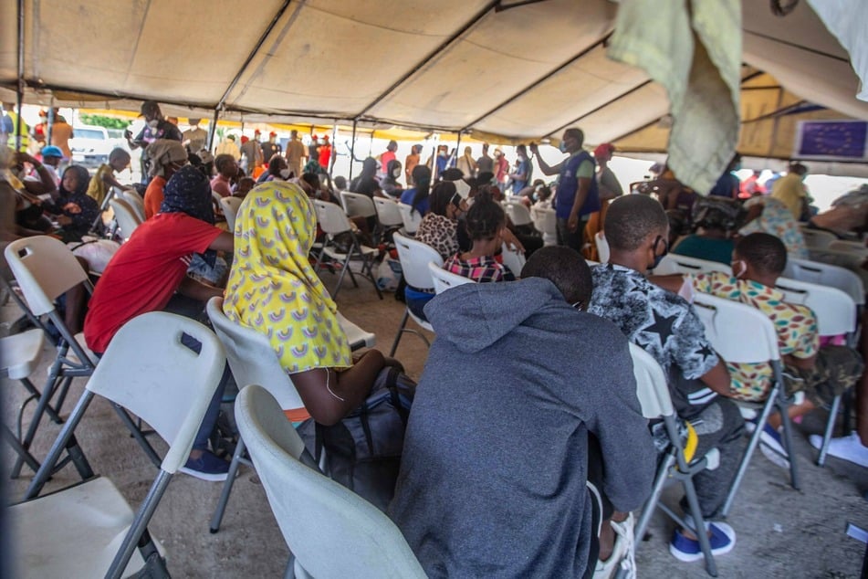 Haitian migrants are treated at the airport in Port-au-Prince after being deported from the United States.