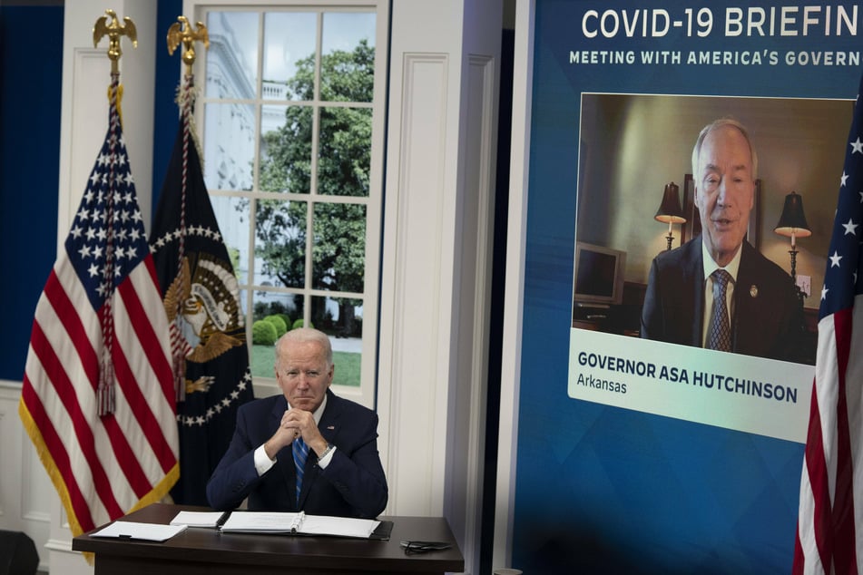 President Joe Biden (l.) participated in a call with the National Governors Association, led by Gov. Asa Hutchinson (pictured r.), to discuss the Omicron variant on Monday.