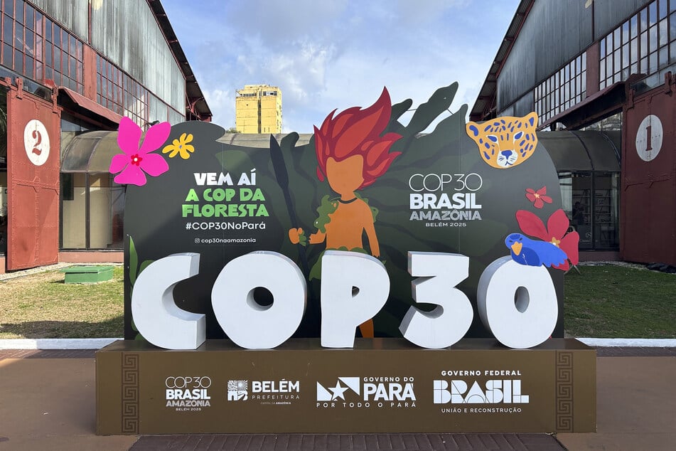 A sign for the COP30 climate talks is pictured at Docks Station in Belem, Para state, Brazil, on October 24, 2025.