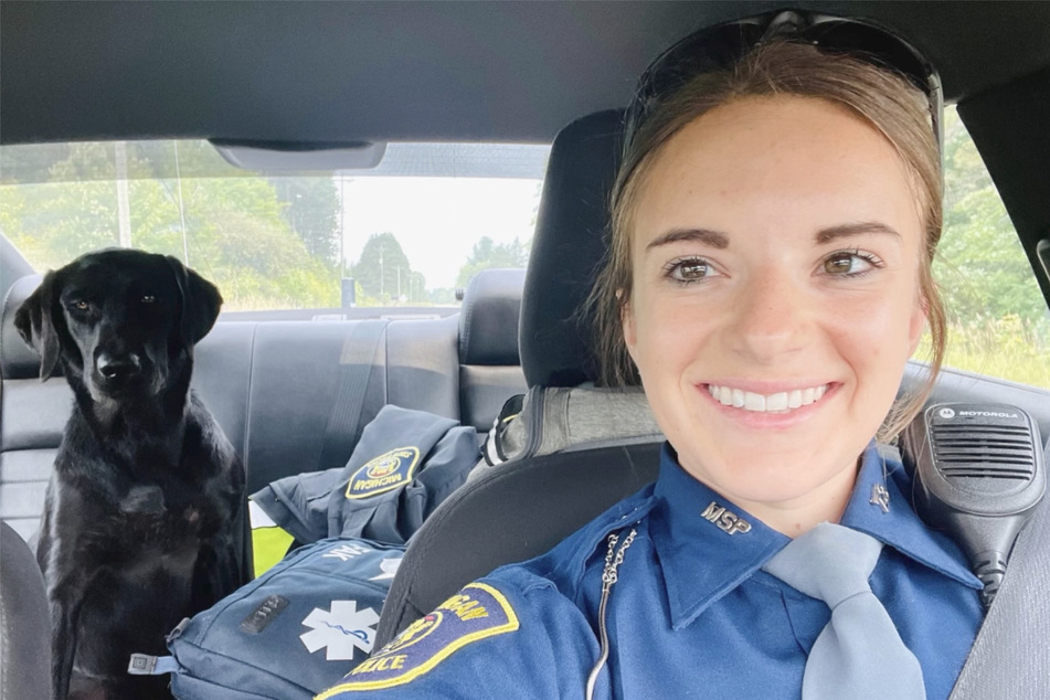 Rosie first made herself comfortable in the back seat of police officer Kayla Moore's car.