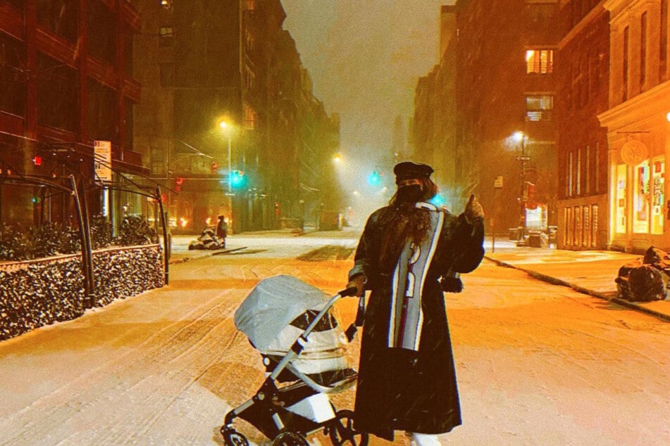 Gigi Hadid takes her baby on a stroll through winter wonderland