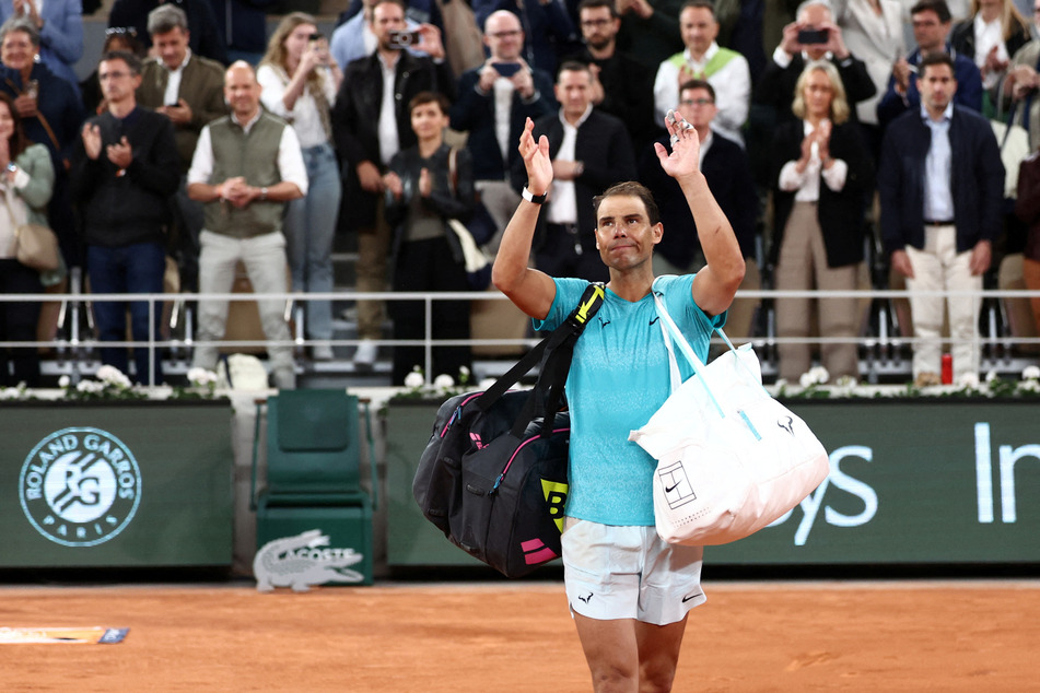 Spain's Rafael Nadal waves to the crowd as he leaves the court after losing his first round match against Germany's Alexander Zverev at the 2024 French Open.