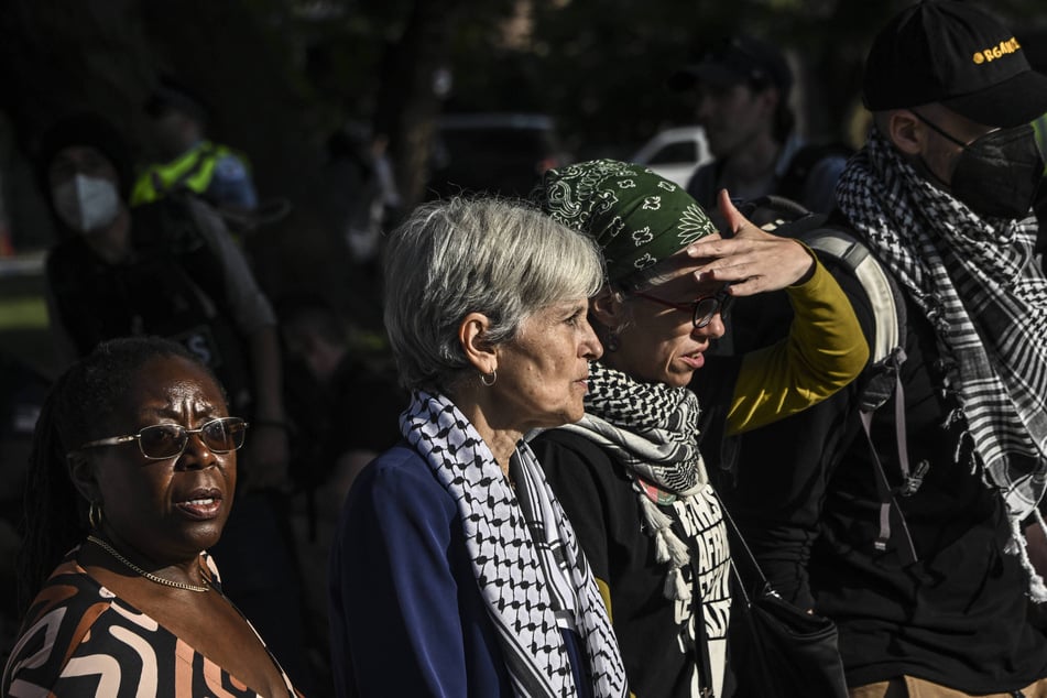 Dr. Jill Stein (c.) attends a pro-Palestine rally outside the 2024 Democratic National Convention in Chicago, Illinois.