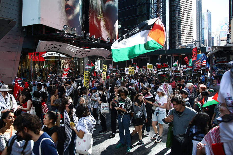 People gather to mark one year of the war between Hamas and Israel in New York City's Times Square on Saturday.