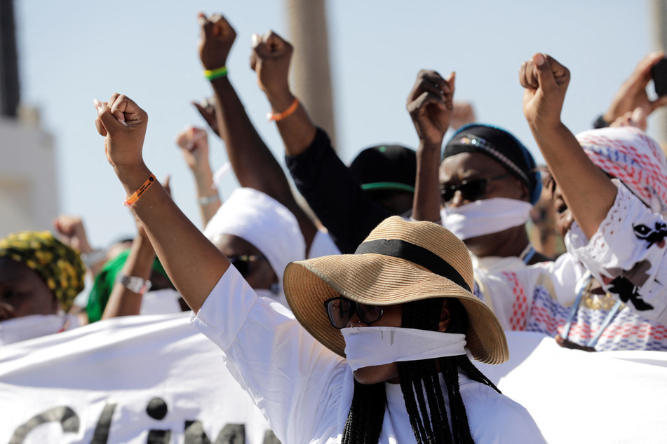 Activists protest for climate justice and human rights at the Sharm El-Sheikh International Convention Center during the COP27 summit.