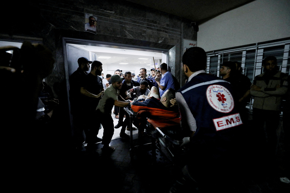 Palestinians say they are trapped in Gaza's Al-Shifa hospital amid an intense Israeli attack.