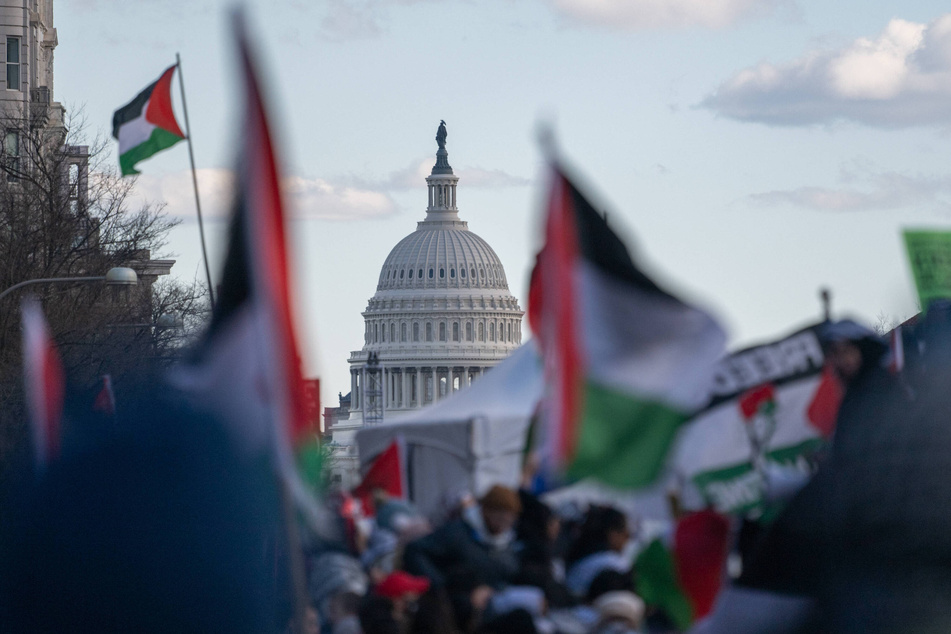 Thousands of people march and rally for a ceasefire in Gaza and an end to US military support for Israel in Washington DC.