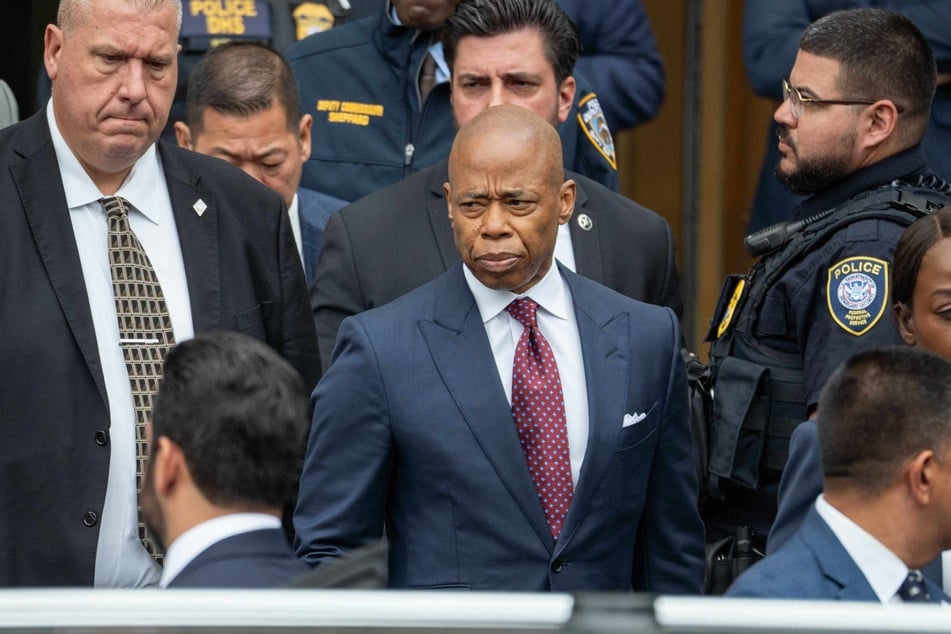 New York City Mayor Eric Adams leaving federal court on Friday after pleading not guilty to fraud and bribery charges in New York City.