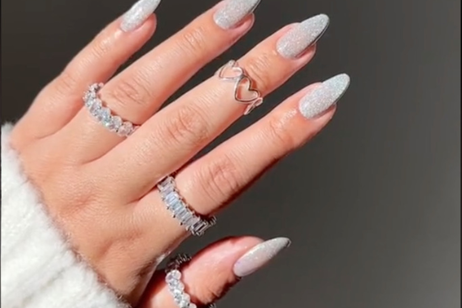 New Year's is all about the glitter and glamour, and with these nails from TikToker @michellekhxn, you'll be ready for any year-end celebration!