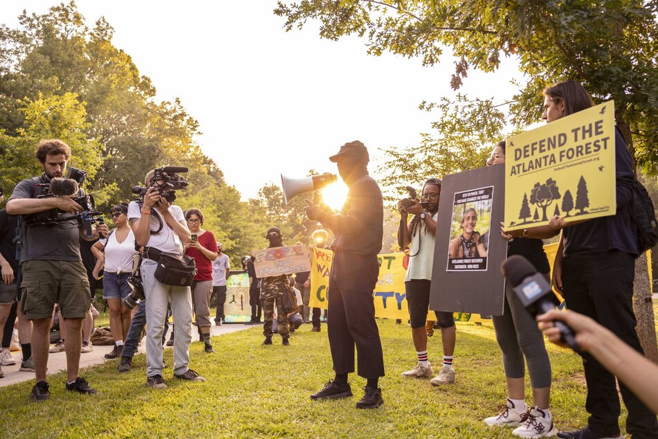 Stop Cop City protesters gather in Atlanta's Gresham Park and march near the location of a proposed new law enforcement training complex.