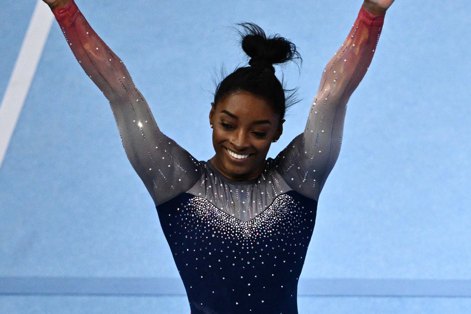 Simone Biles helped secure the seventh straight women's team gold for the US at the world gymnastics championships on Wednesday.