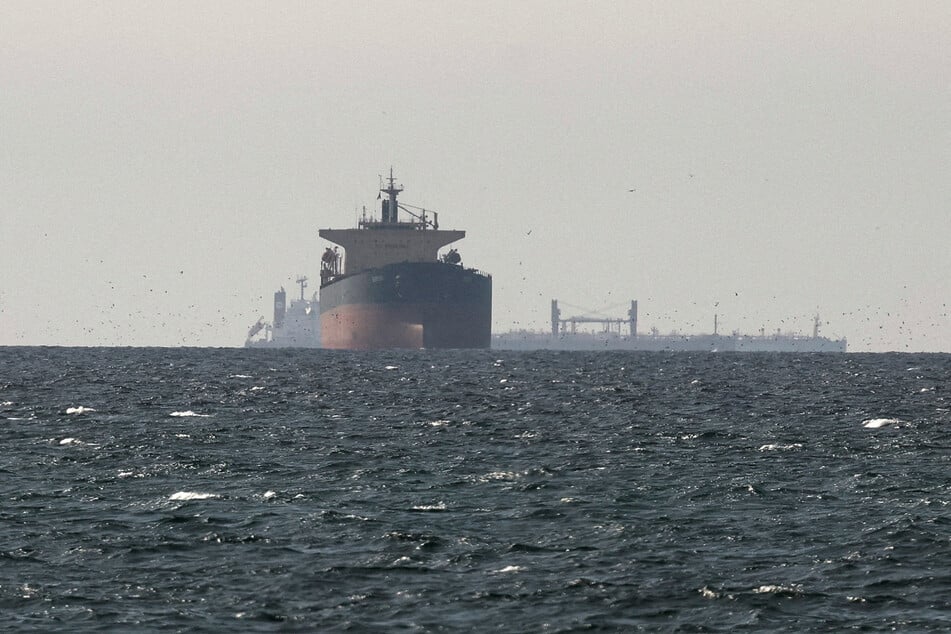 Tankers sail in the Gulf near the Strait of Hormuz, as seen from northern Ras al-Khaimah, on March 11, 2026.