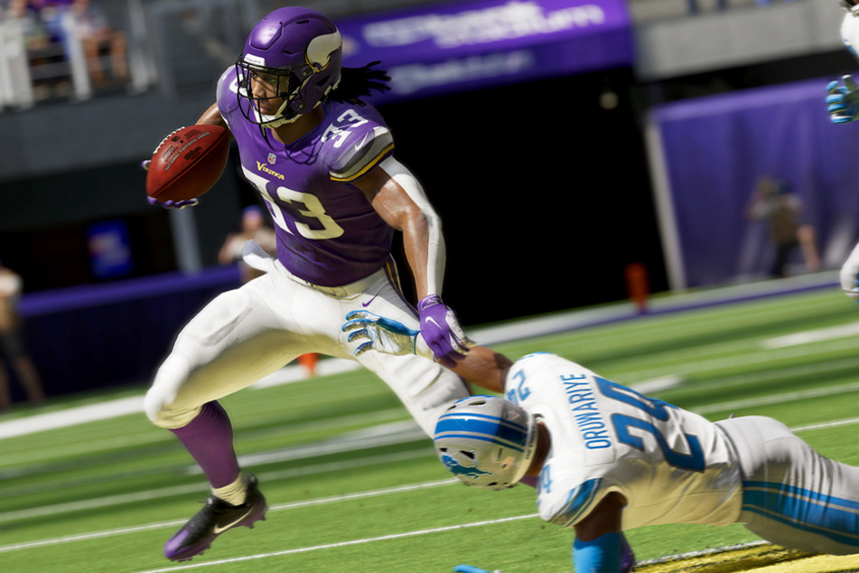 Amani Oruwariye, Cornerback der Detroit Lions, hat keine Chance gegen Running Back Dalvin Cook von den Minnesota Vikings.