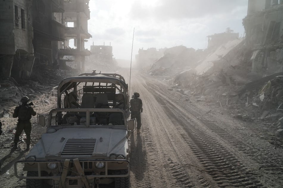 Israeli soldiers patrol next to destroyed buildings in Rafah in the Gaza Strip on September 13, 2024.