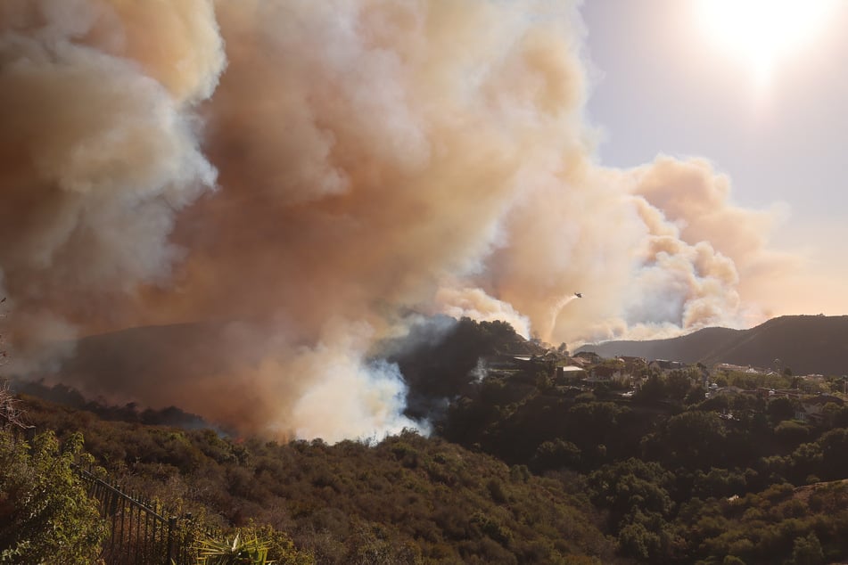 Hundreds of firefighters are battling a fire that has spread over 3,000 acres.