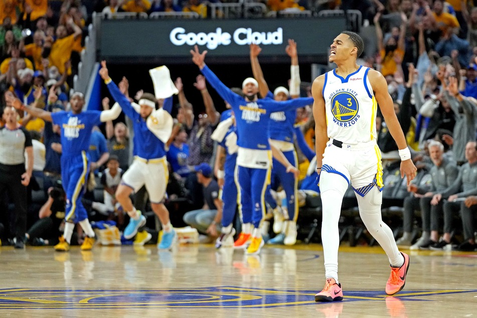 Jordan Poole celebrates his amazing, buzzer-beating three-pointer at the end of the third quarter.