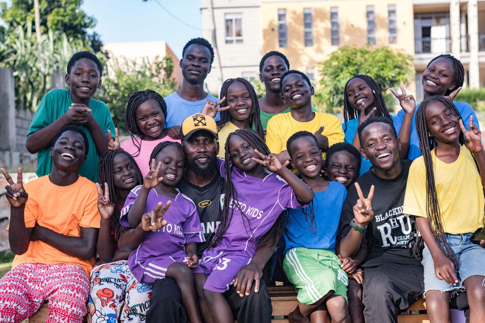 Members of the dance group The Ghetto Kids pose for a picture after a day's rehearsal at their home in Nakawuka, Wakiso, Uganda, on May 25, 2026.