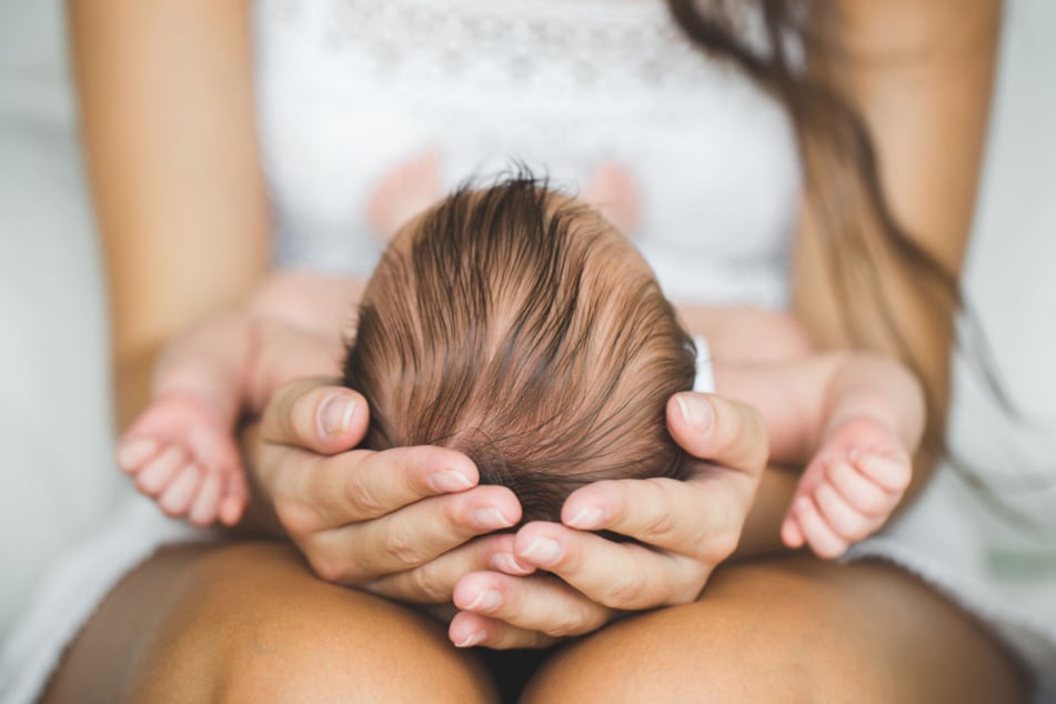 The mother was holding her supposedly dead baby in her lap when it began to stir (stock image).