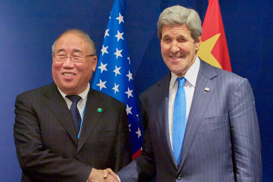 US climate enjoy John Kerry (r) met with his Chinese counterpart, Xie Zhenhua, over the weekend.