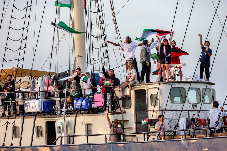 Activists and human rights defenders ride aboard a vessel departing from Tunisia's northern port of Bizerte as part of the Global Sumud Flotilla on September 14, 2025.