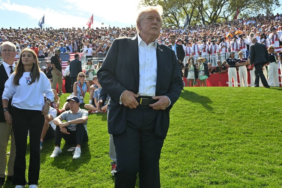 President Donald Trump (r.) and his granddaughter Kai Madison Trump (l.) attend the 45th Ryder Cup golf competition at Bethpage Black Course in Farmingdale, New York, on Friday.