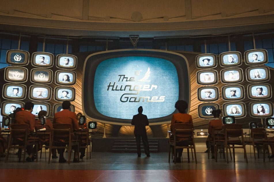 The Hunger Games movies are based on the book series written by author Suzanne Collins.