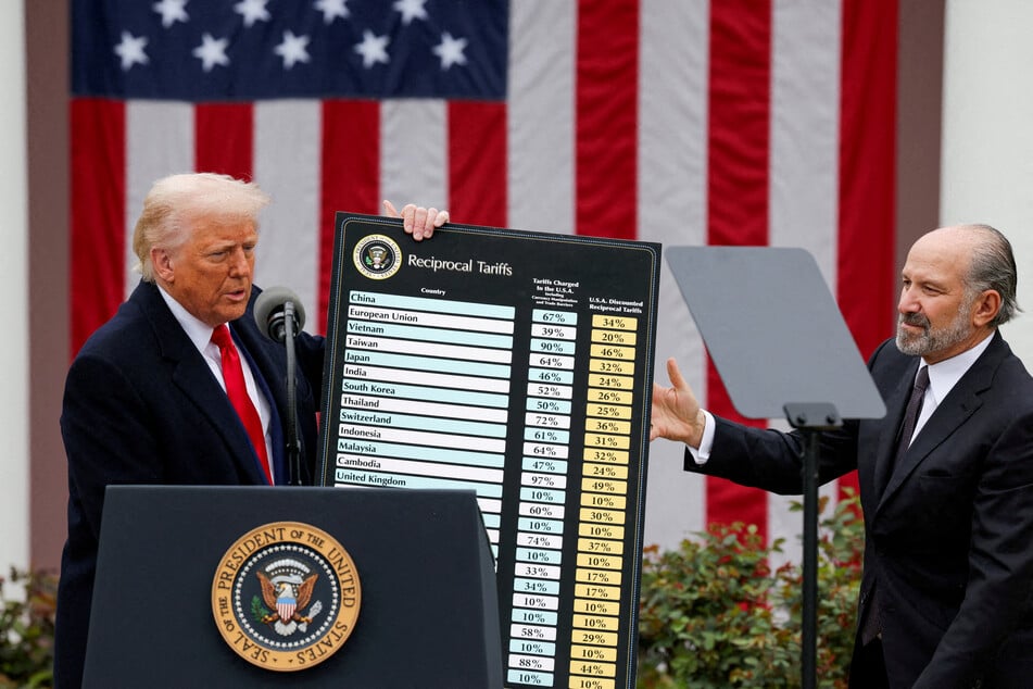 Secretary of Commerce Howard Lutnick (r.) stands next to President Donald Trump as the latter delivers remarks on tariffs in the Rose Garden at the White House on April 2, 2025.