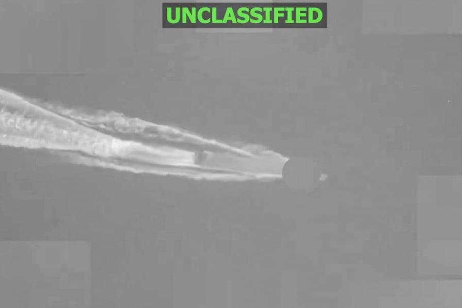 This screen grab, obtained from a video released by the US Central Command on their X account @CENTCOM on Friday, shows a strike on an alleged drug-smuggling vessel in the eastern Pacific Ocean