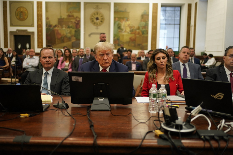 Former president Donald Trump took a seat at the defense table flanked by his lawyers for day two of his New York civil trial.