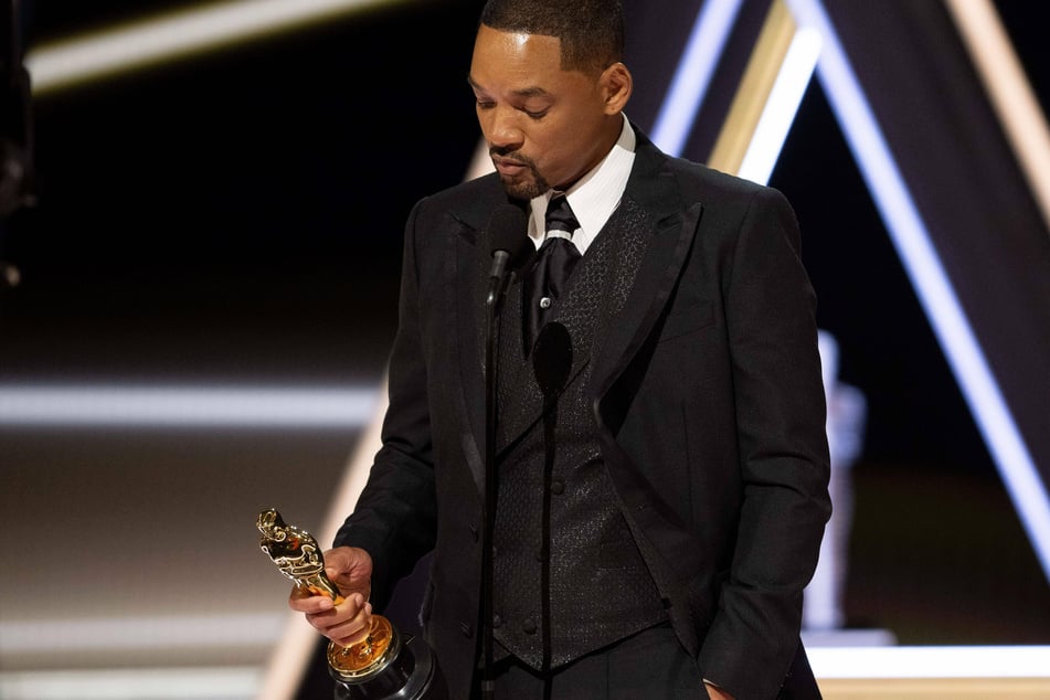 Will Smith accepting the Academy Award for best actor, not long after having slapped Chris Rock for a joke.