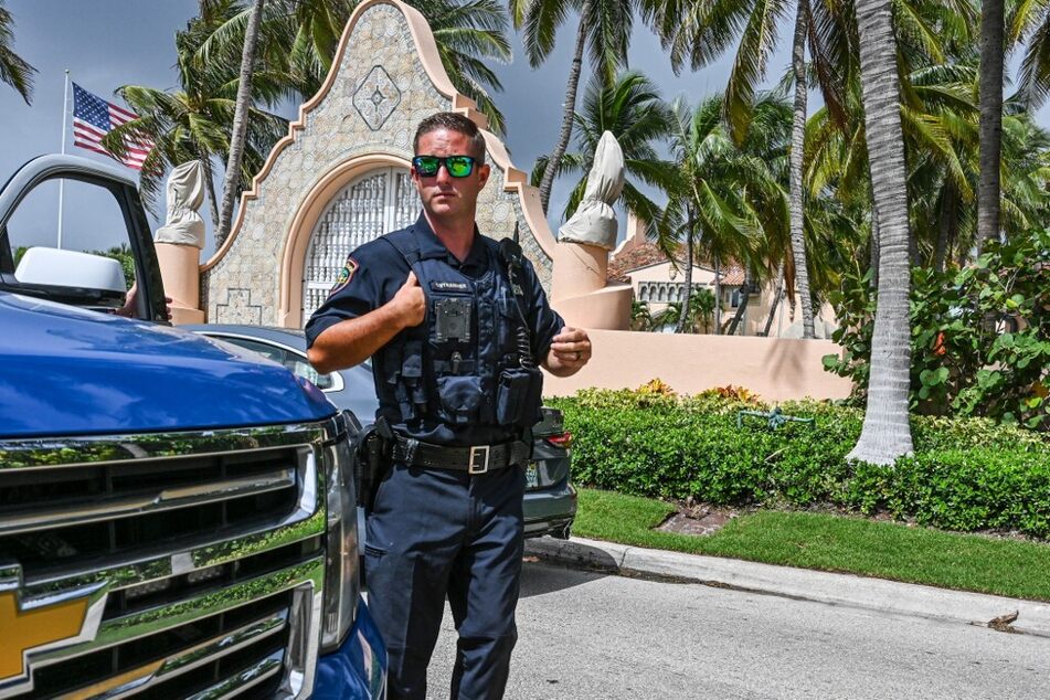 Local law enforcement officers are seen in front of Donald Trump's home at Mar-A-Lago on August 9, 2022.