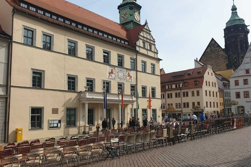 The chairs were placed in front of the town hall.