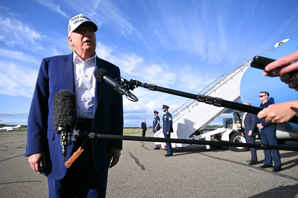 President Donald Trump speaks to journalists before boarding Air Force One from Morristown Municipal Airport in Morristown, New Jersey on May 25, 2025.