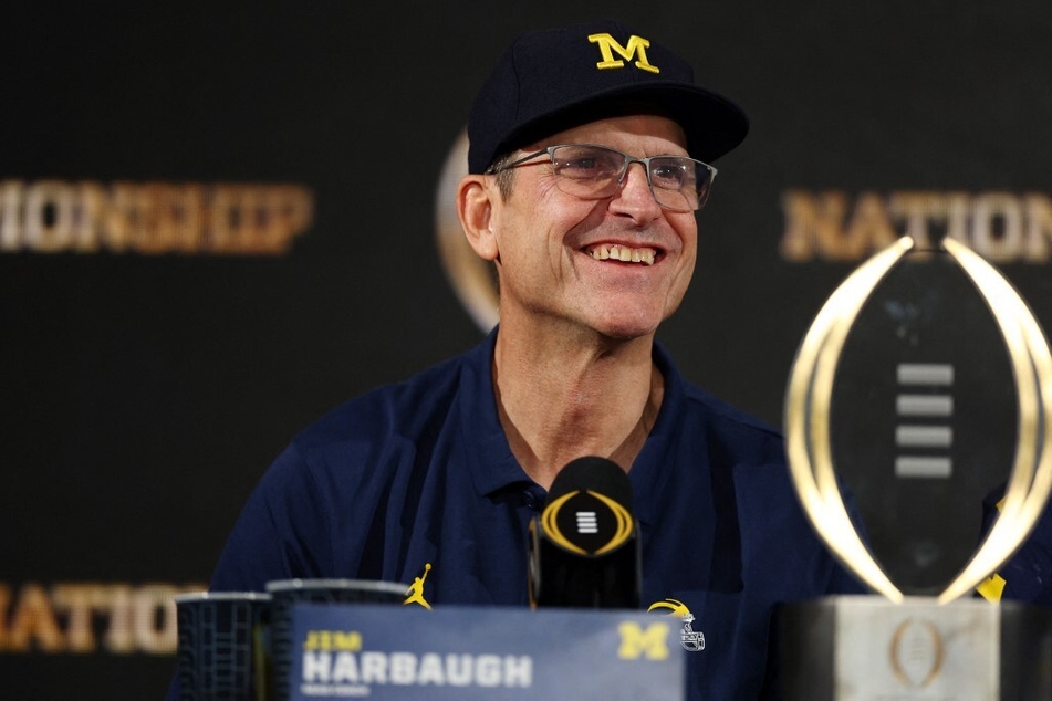 Jim Harbaugh is trying to secure protection from being fired due to the NCAA investigations into Michigan's football program amid a new Michigan contract.