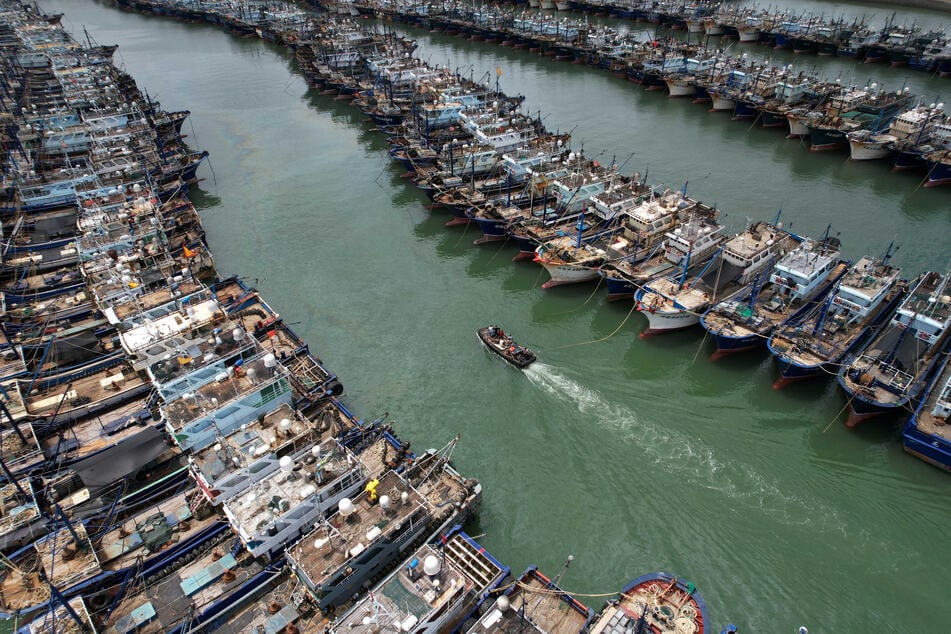 Fishing boats are seen moored at Gaoqi fishing port as typhoon Doksuri approaches, in Xiamen, Fujian province, China.