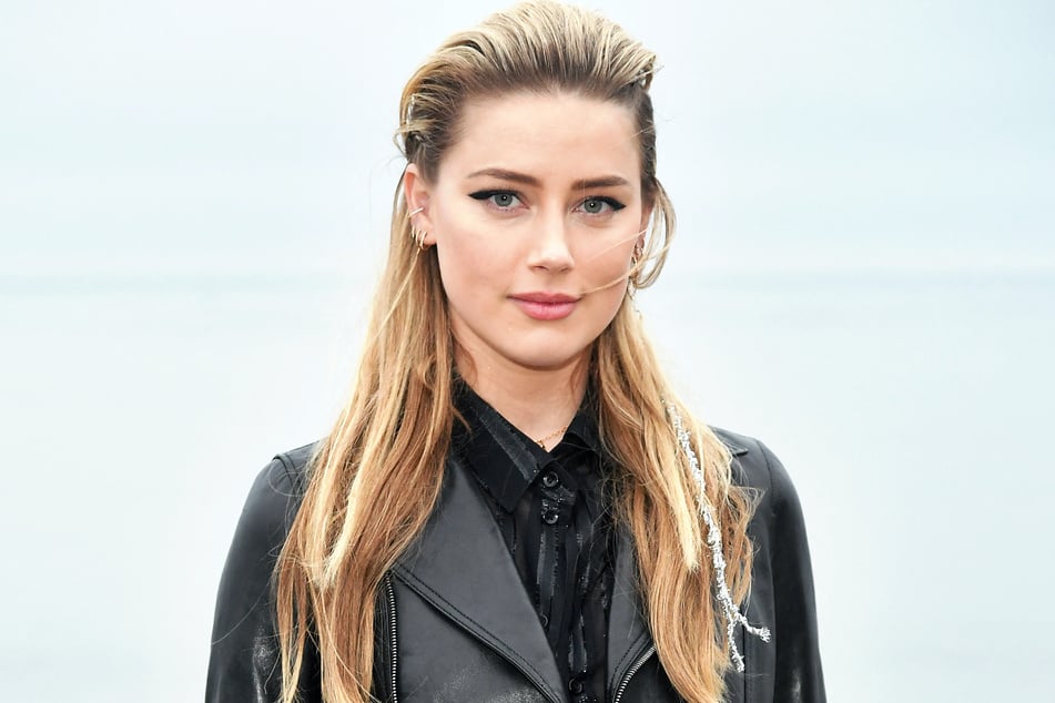Amber Heard revealed that she recently become a mom of three with the addition of her twins.