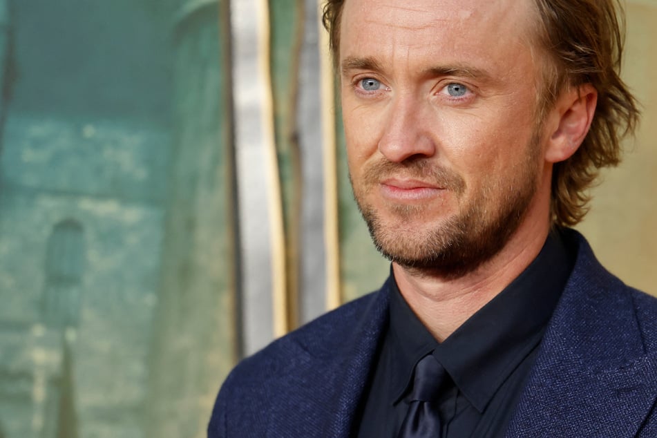 Tom Felton attends the premiere of Fantastic Beasts: Secrets of Dumbledore in March 2022.