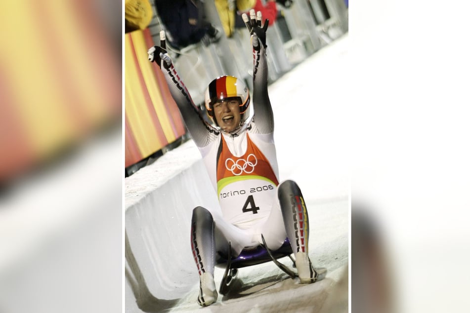 Eine Chemnitzerin ist Olympiasiegerin: Rennrodlerin Sylke Otto im Ziel im Turiner Eiskanal.